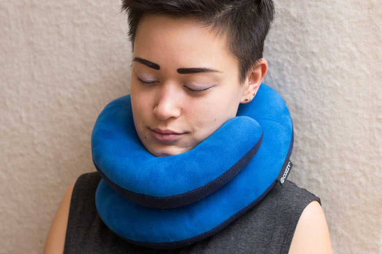 Woman wearing the Bcozzy Pillow.